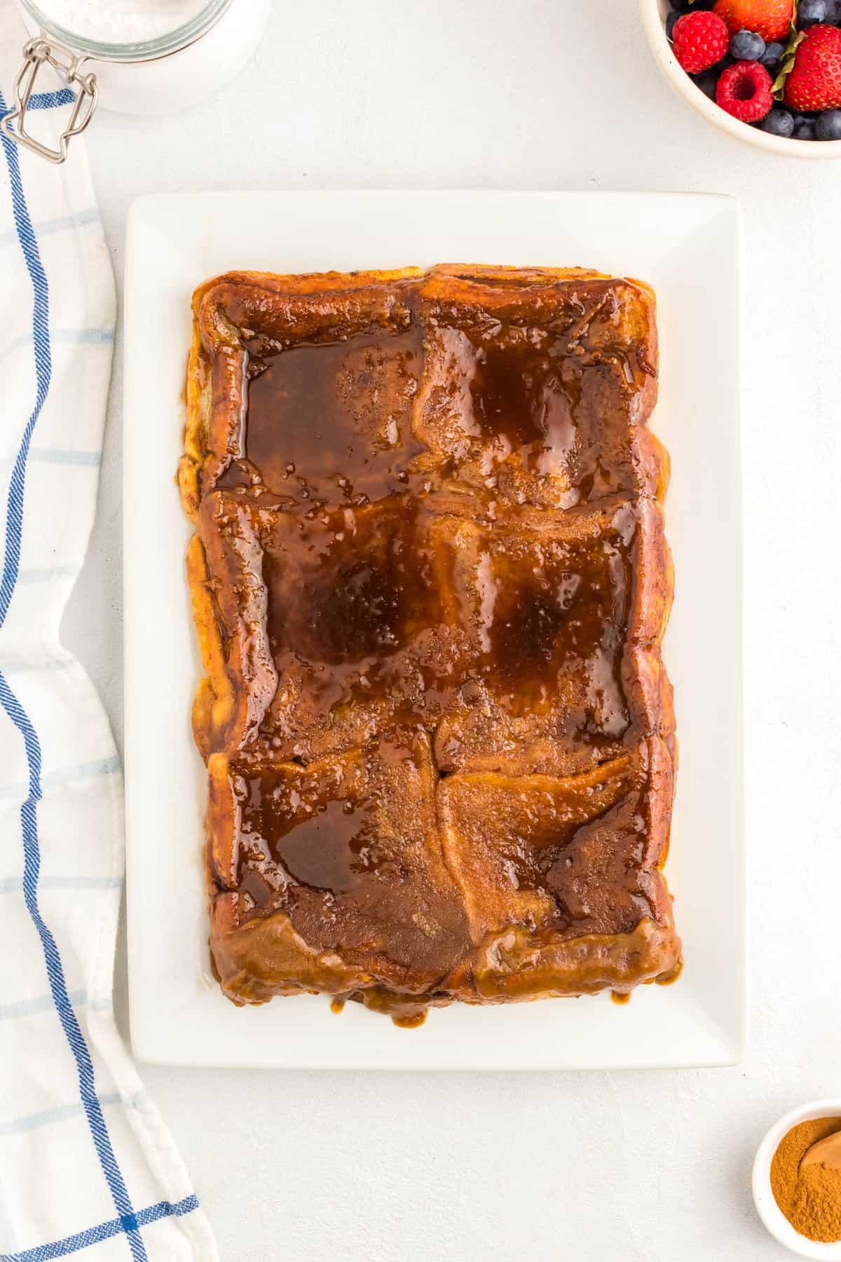 Flipping Overnight French Toast Bake over onto serving plate