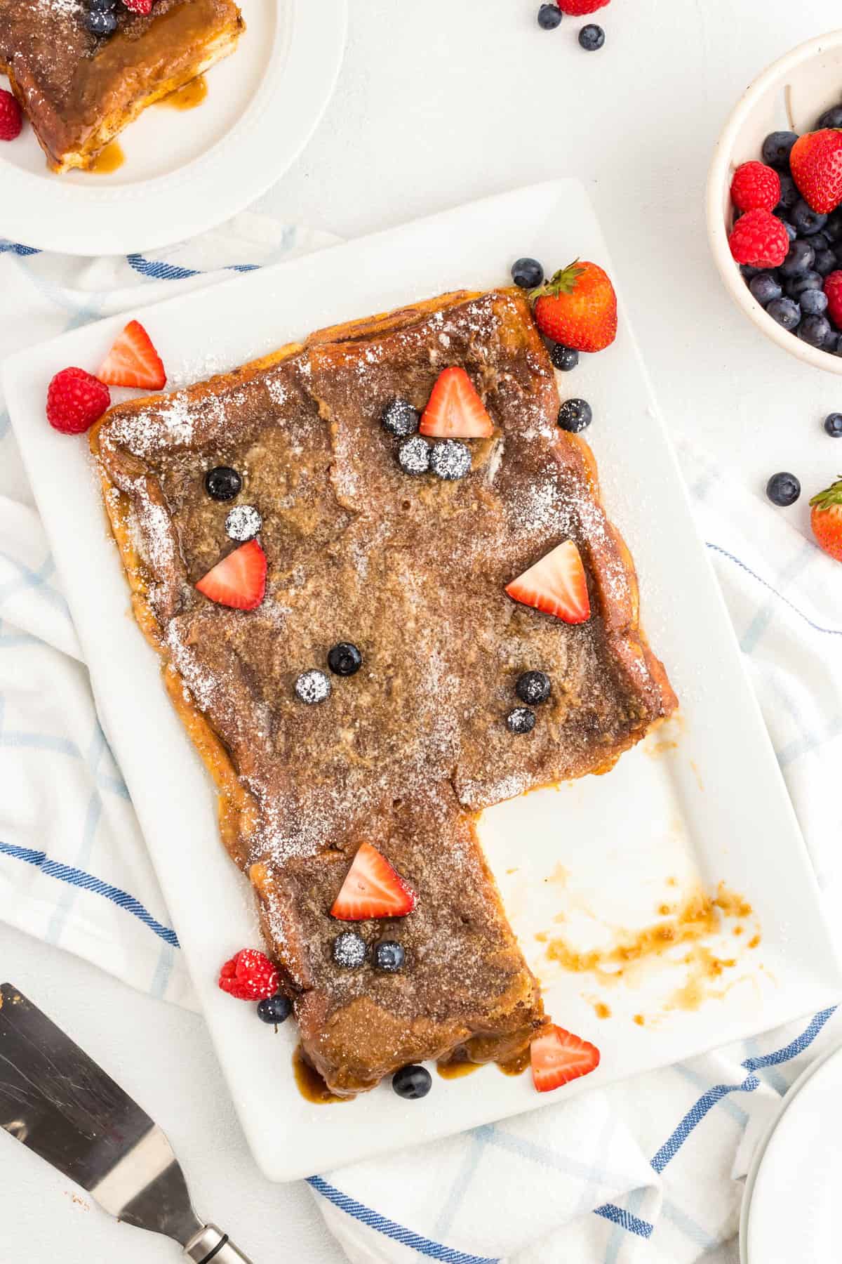 Adding fresh fruit to Overnight French Toast before serving 