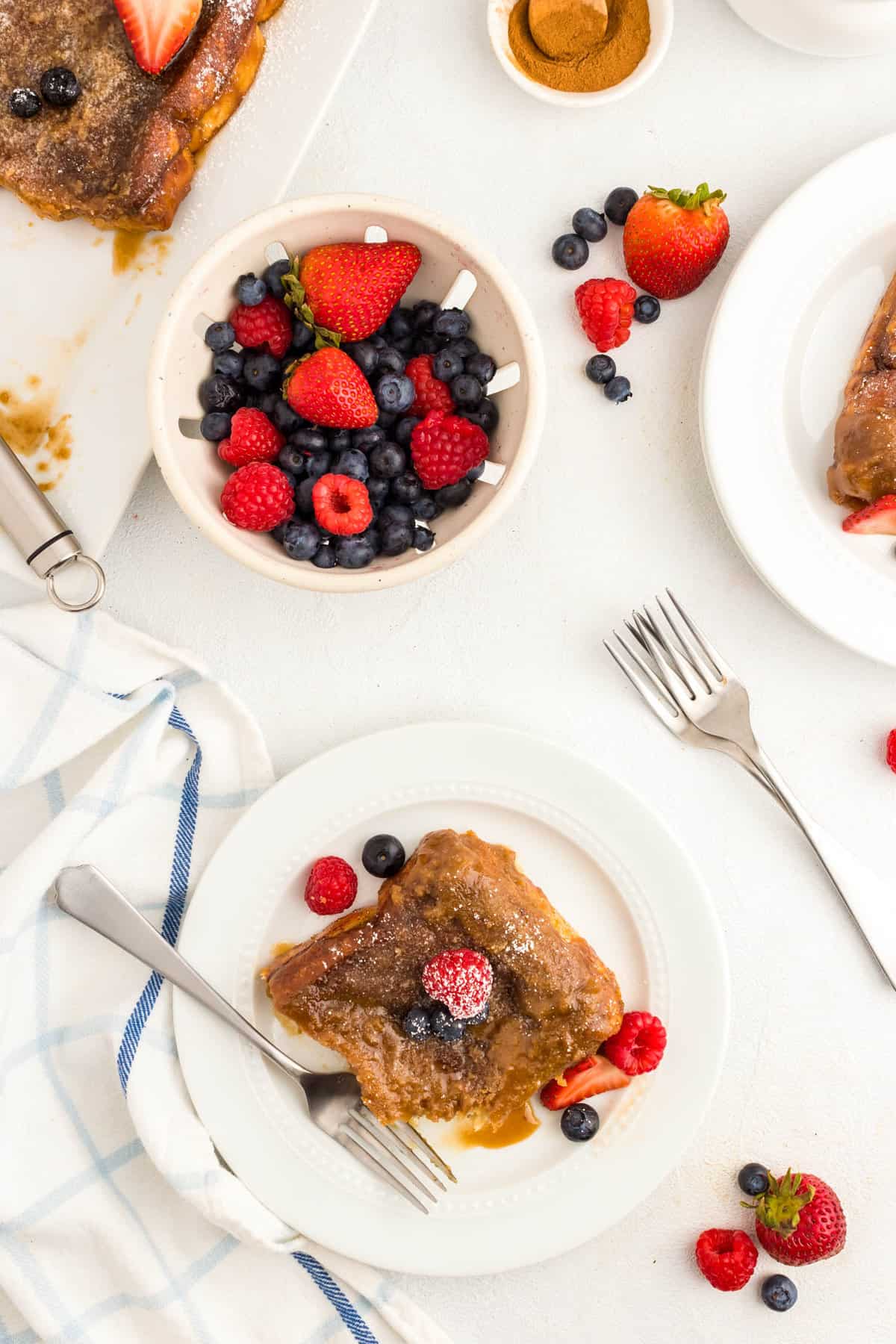 Overnight French Toast slice on plate with the added fixings