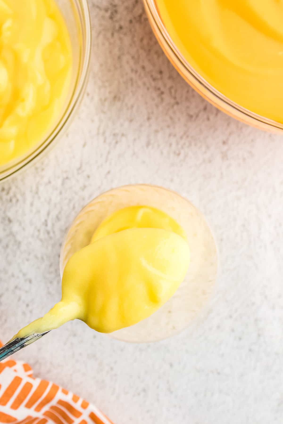 in a Plastic cup add 4 spoonfuls of normal yellow pudding for the bottom layer.