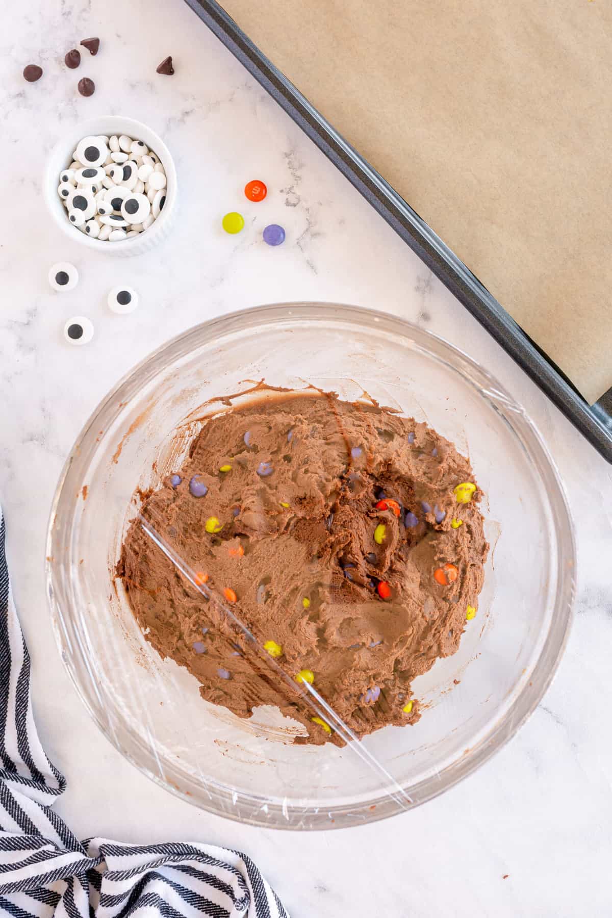 M&Ms and chocolate chips mixed together well. Put plastic wrap on top of bowl and refrigerate for 30 minutes.