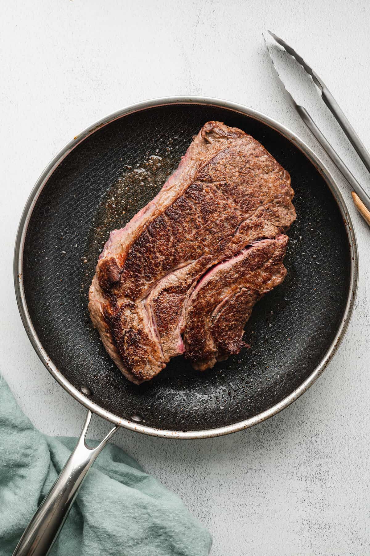 Searing roast with olive oil in stovepot pan for French Dip 