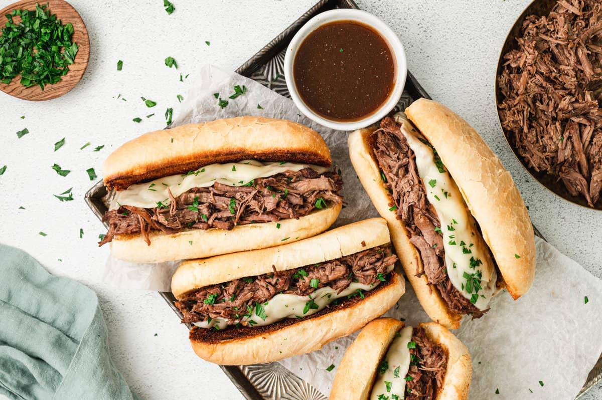 French Dip Sandwiches on Serving Plate with Salty Au Jus