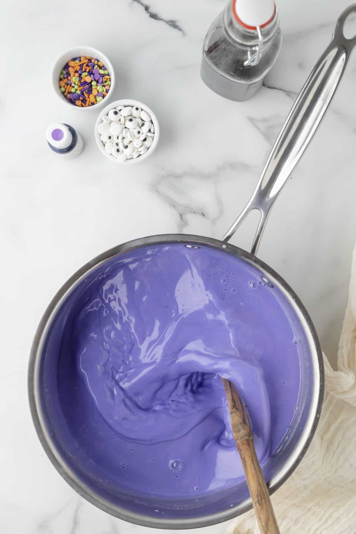 Mix the Food Coloring in well until its to a purple that you like.