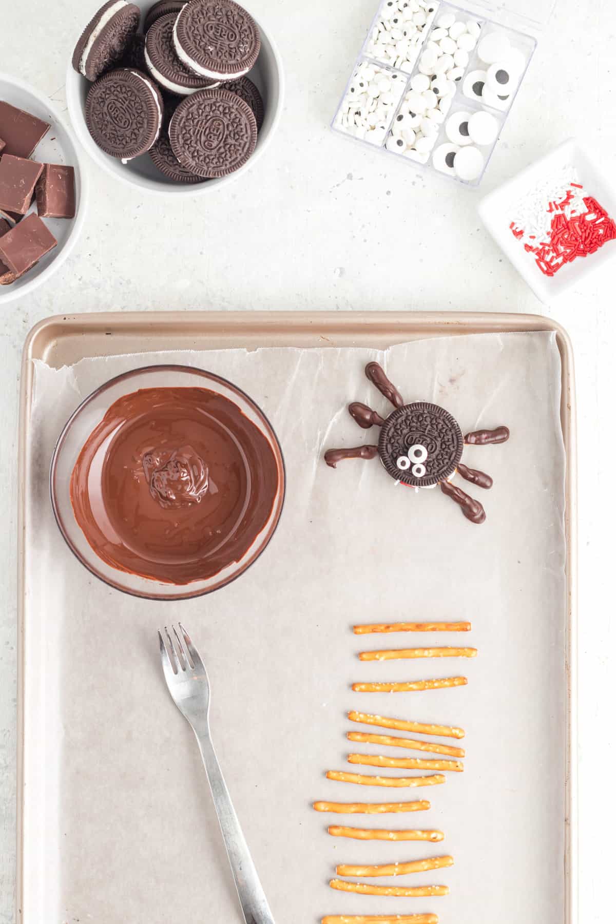 Line a Baking Sheet with Wax Paper. In a Medium Microwave safe bowl melt the chocolate.