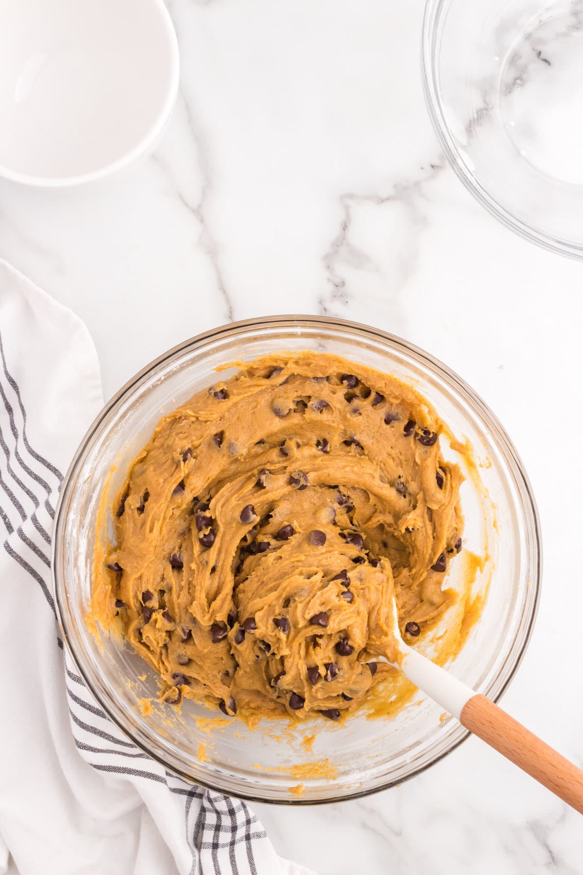 Pumpkin Chocolate Chip Cookies dough in mixing bowl with spoon