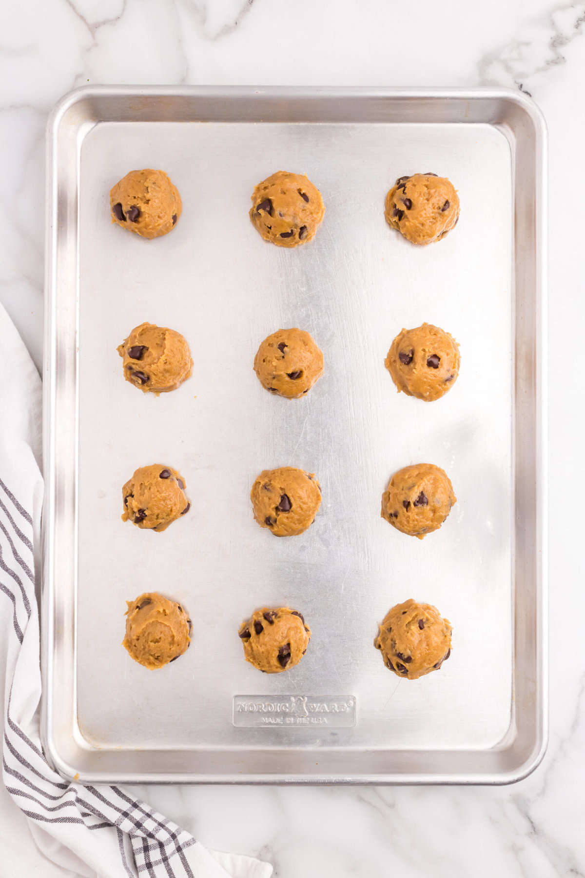 Raw Pumpkin Chocolate Chip Cookies on baking sheet 