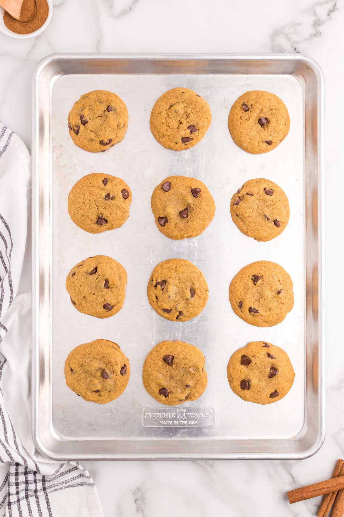 Baked Pumpkin Chocolate Chip Cookies on cookie sheet just out of the oven