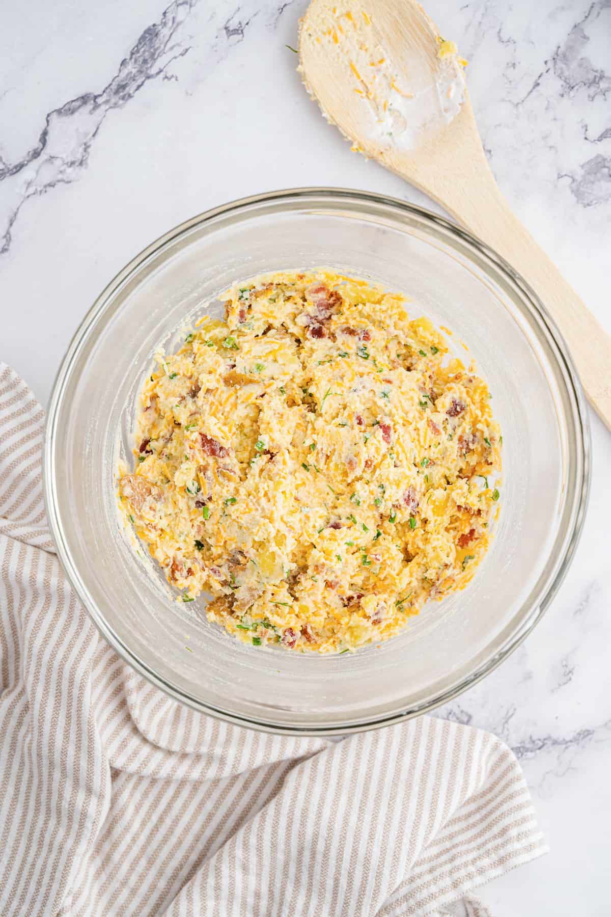 Mixed twice baked potato ingredients in mixing bowl