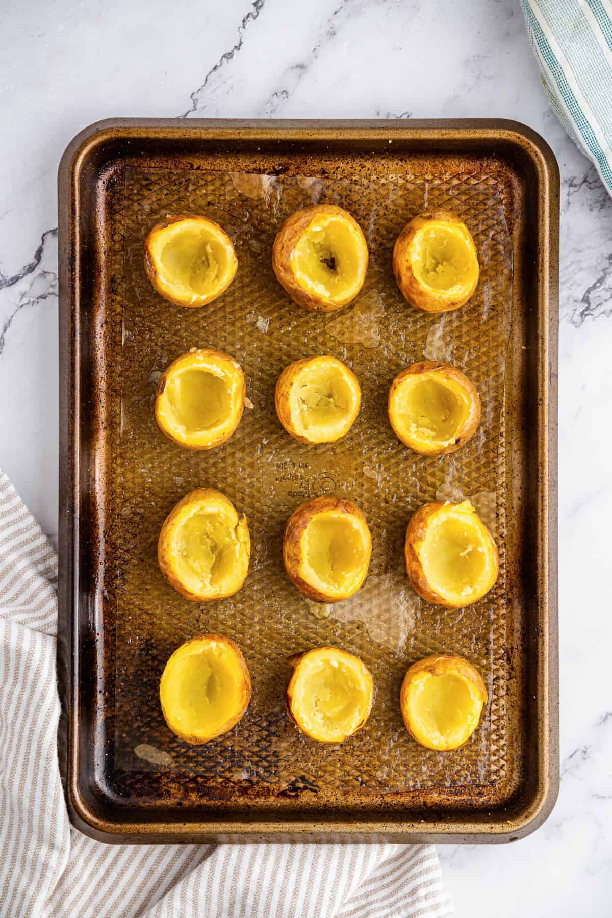 Scooping potatoes for Mini Twice Baked Potatoes recipe