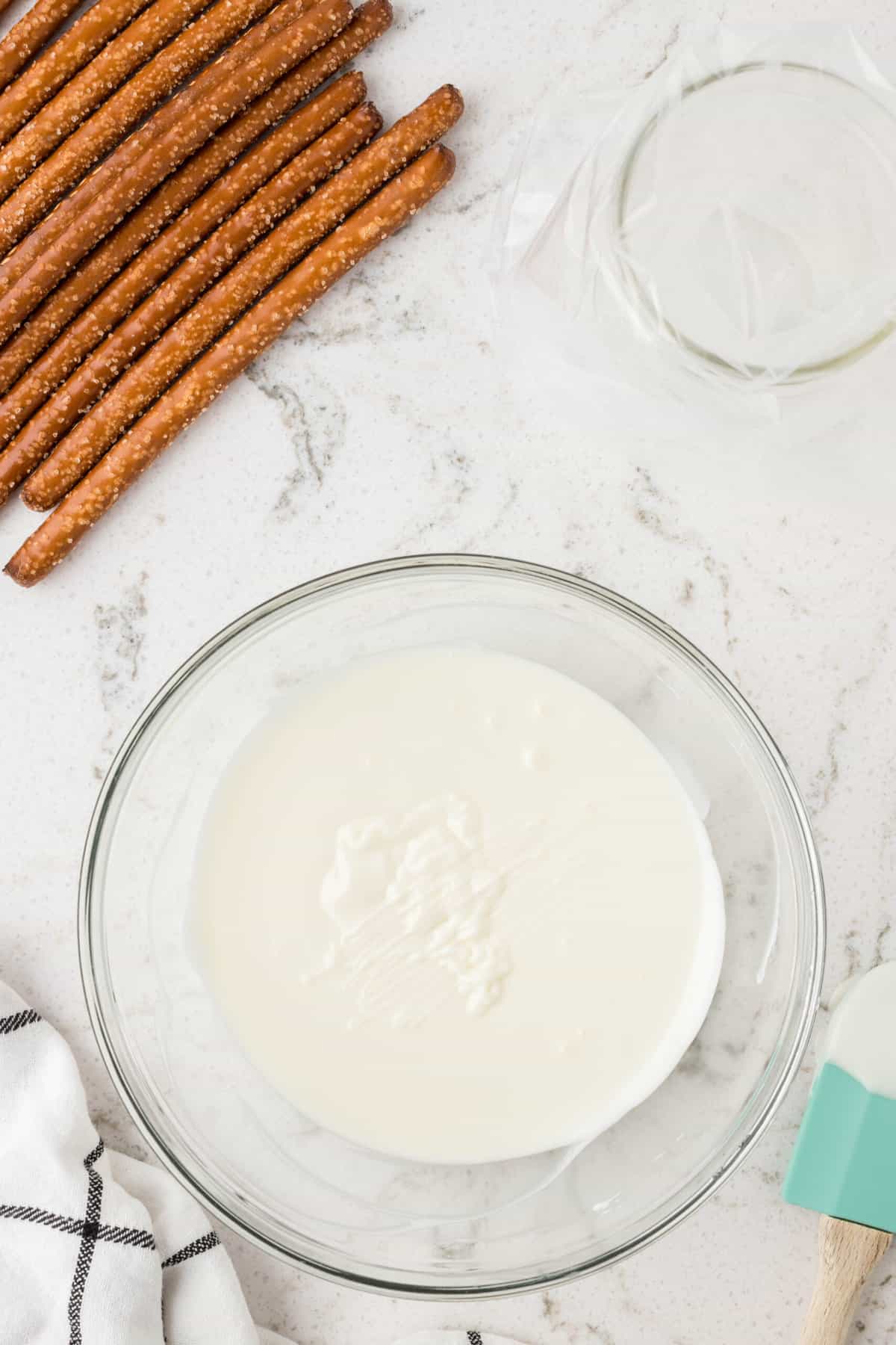 Melt the almond bark in a microwave safe bowl and put into a piping bag when its melted.