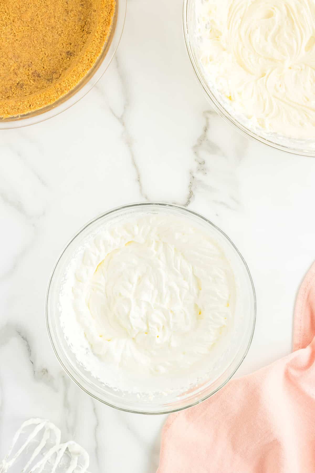 Whipping Cream in Bowl for No Bake Cheesecake Recipe