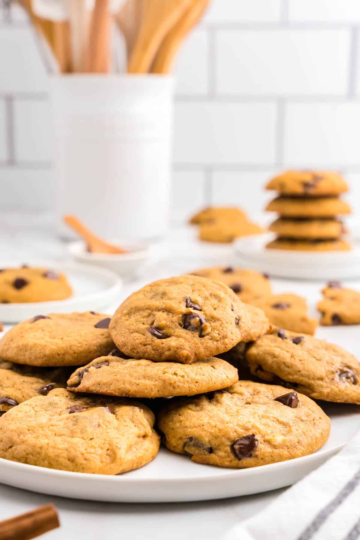 Easy Pumpkin Chocolate Chip Cookies stacked on plate