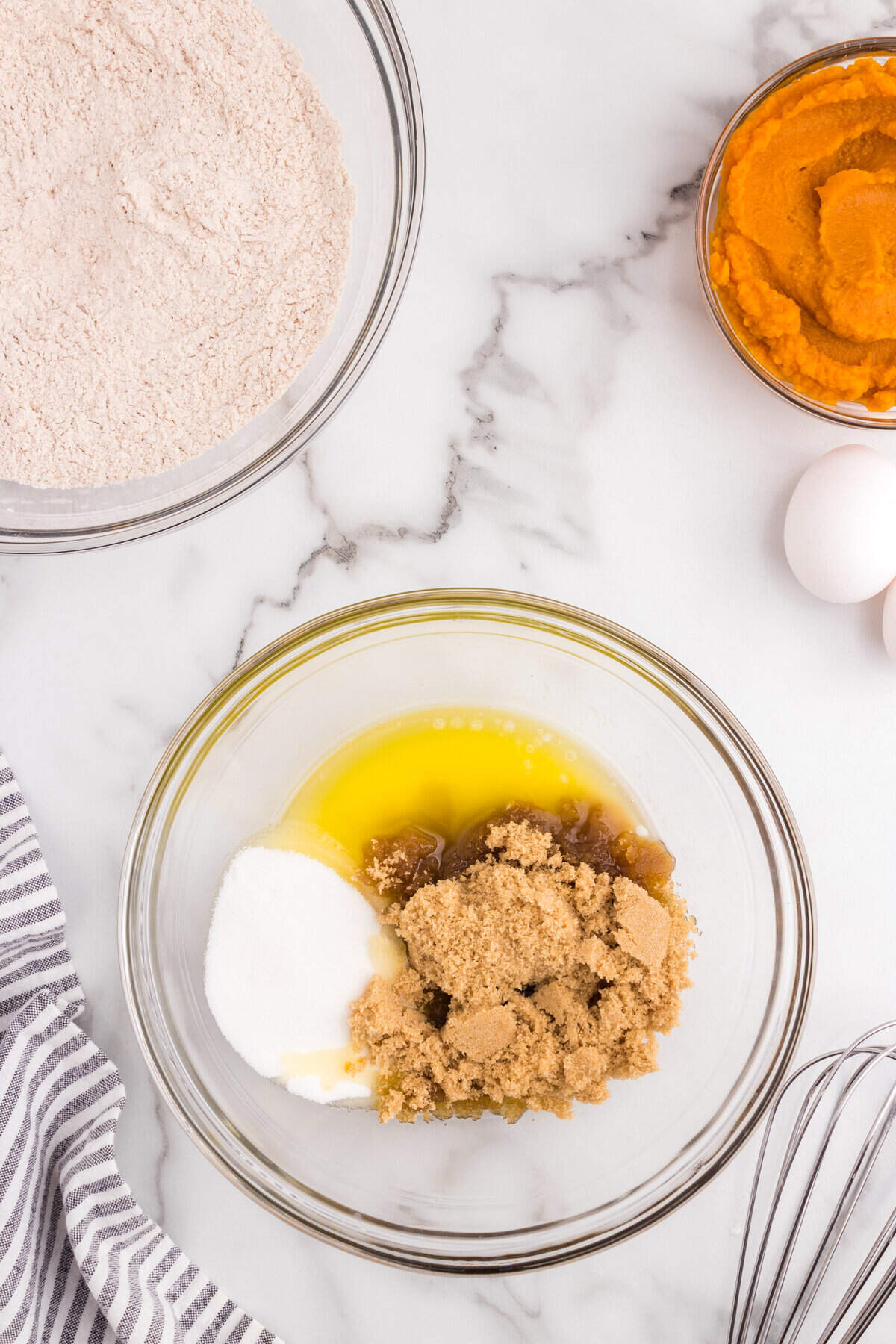 Combing wet ingredients   and sugars in mixing bowl for Pumpkin Donuts