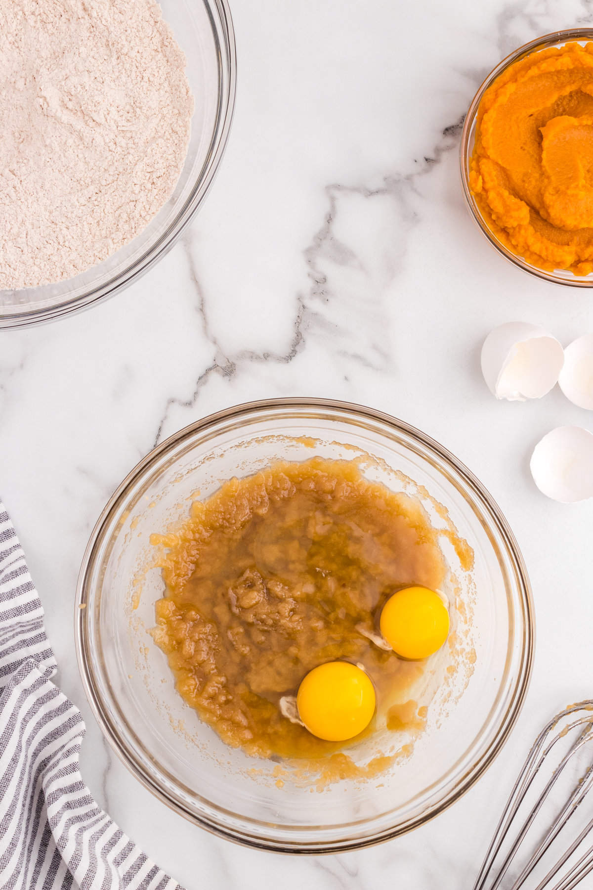 Adding in eggs to wet ingredients for Pumpkin Donuts recipe