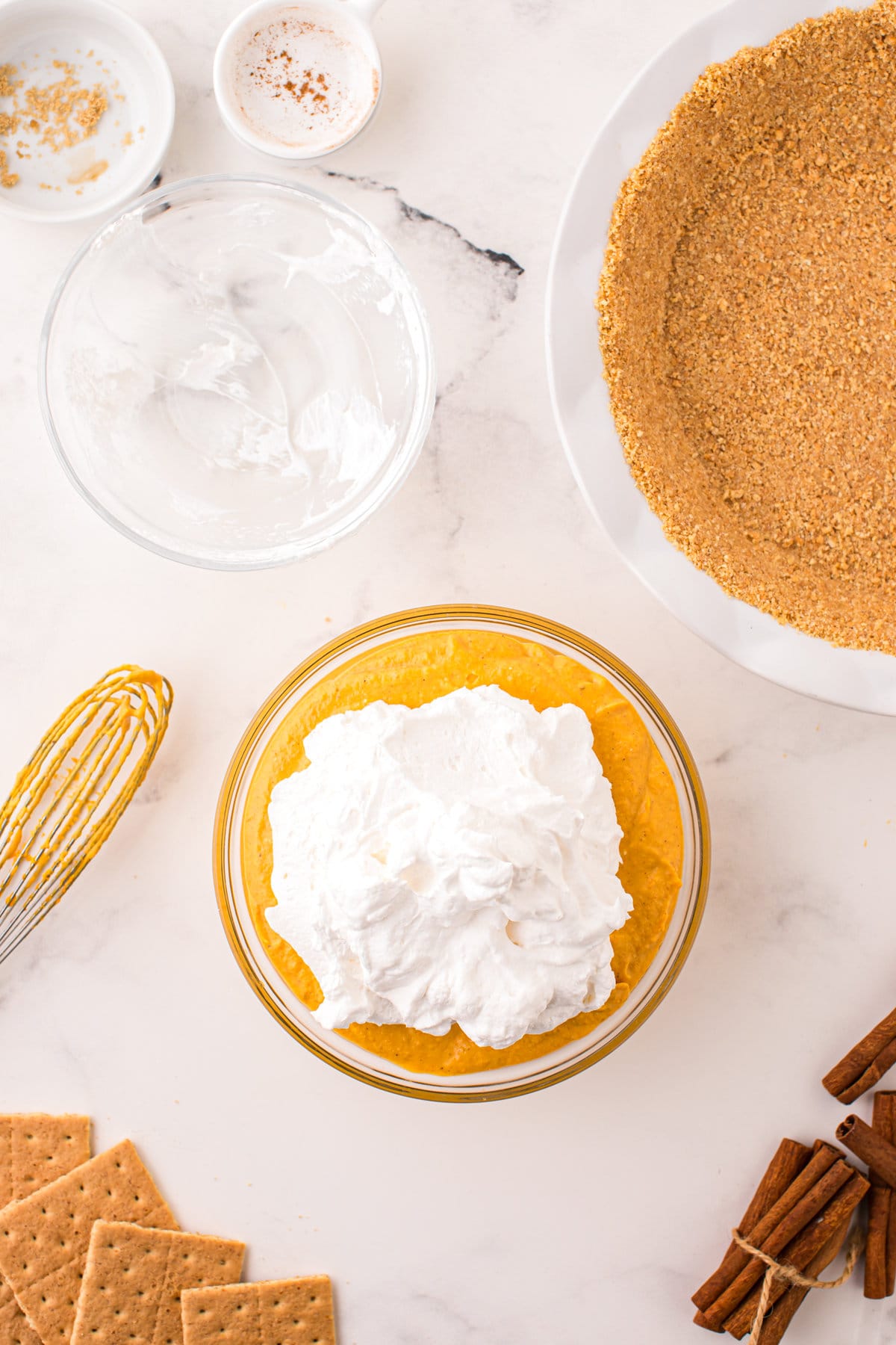 Adding prepared whipped cream (cool whip) to pie filling mixture