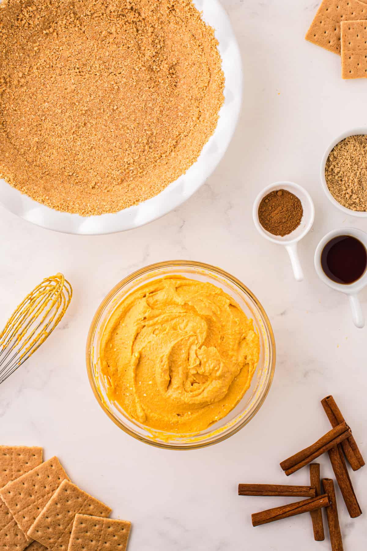 Pumpkin pie filling mixed in mixing bowl for Pumpkin Mousse Pie recipe