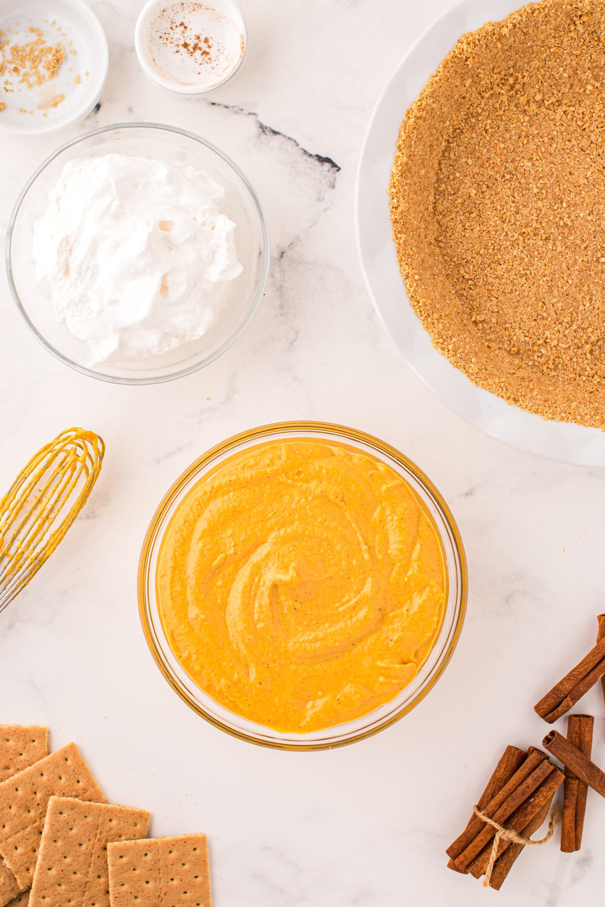 Smooth pie filling mixture in bowl for Pumpkin Mousse Pie