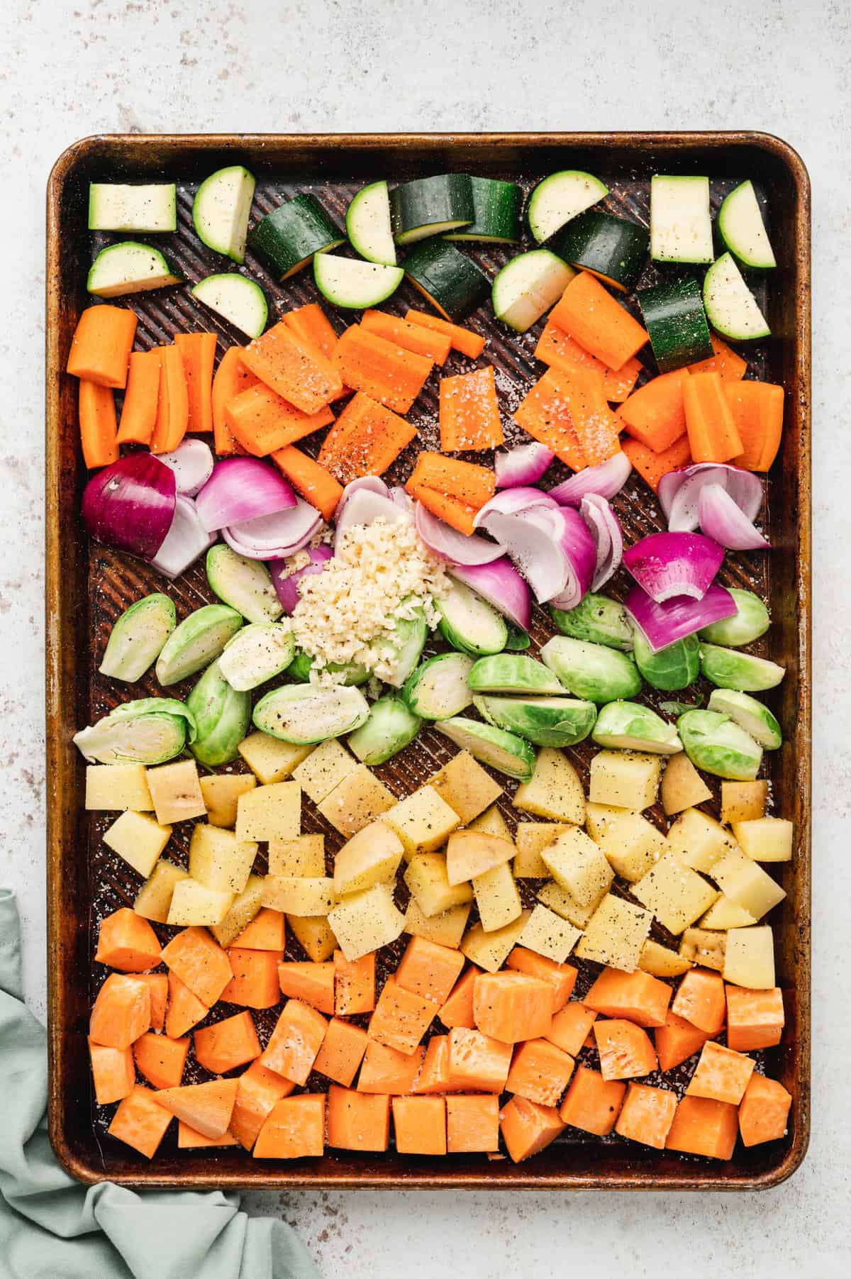 Cut and prepared vegetables on baking sheet for Roasted Vegetables recipe
