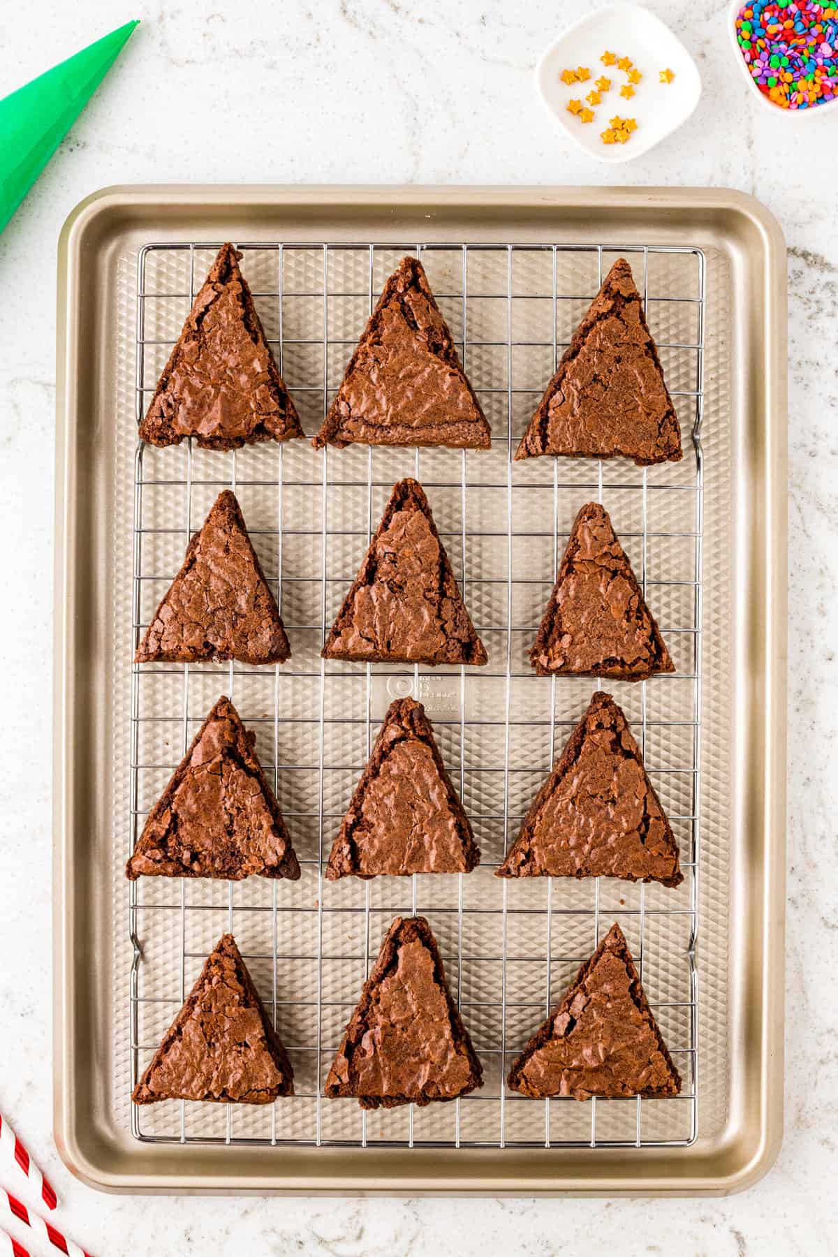 Cut the Brownie into 12 equal squares. Then cut Triangles out of Each Square, place the Extras in a bag to snack on.