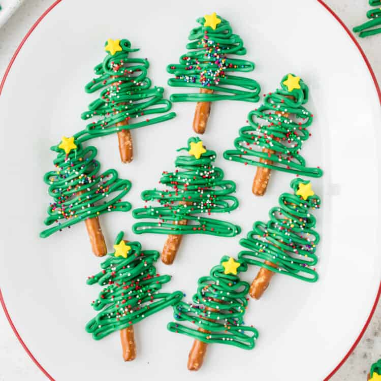 White Plate with Christmas Tree Pretzels displayed on them.