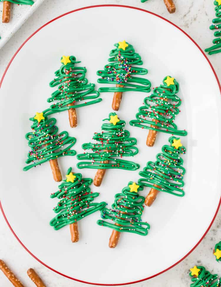 White Plate with Christmas Tree Pretzels displayed on them.