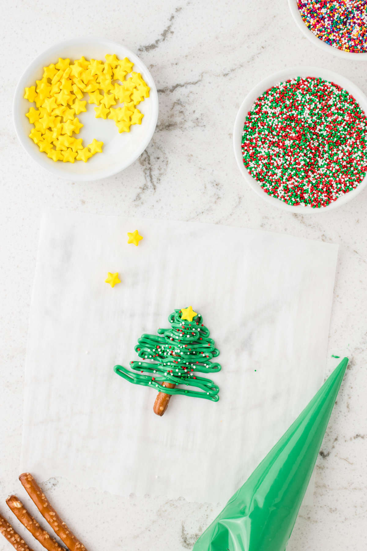 Add a Candy Star at the top of the Christmas Tree Pretzels