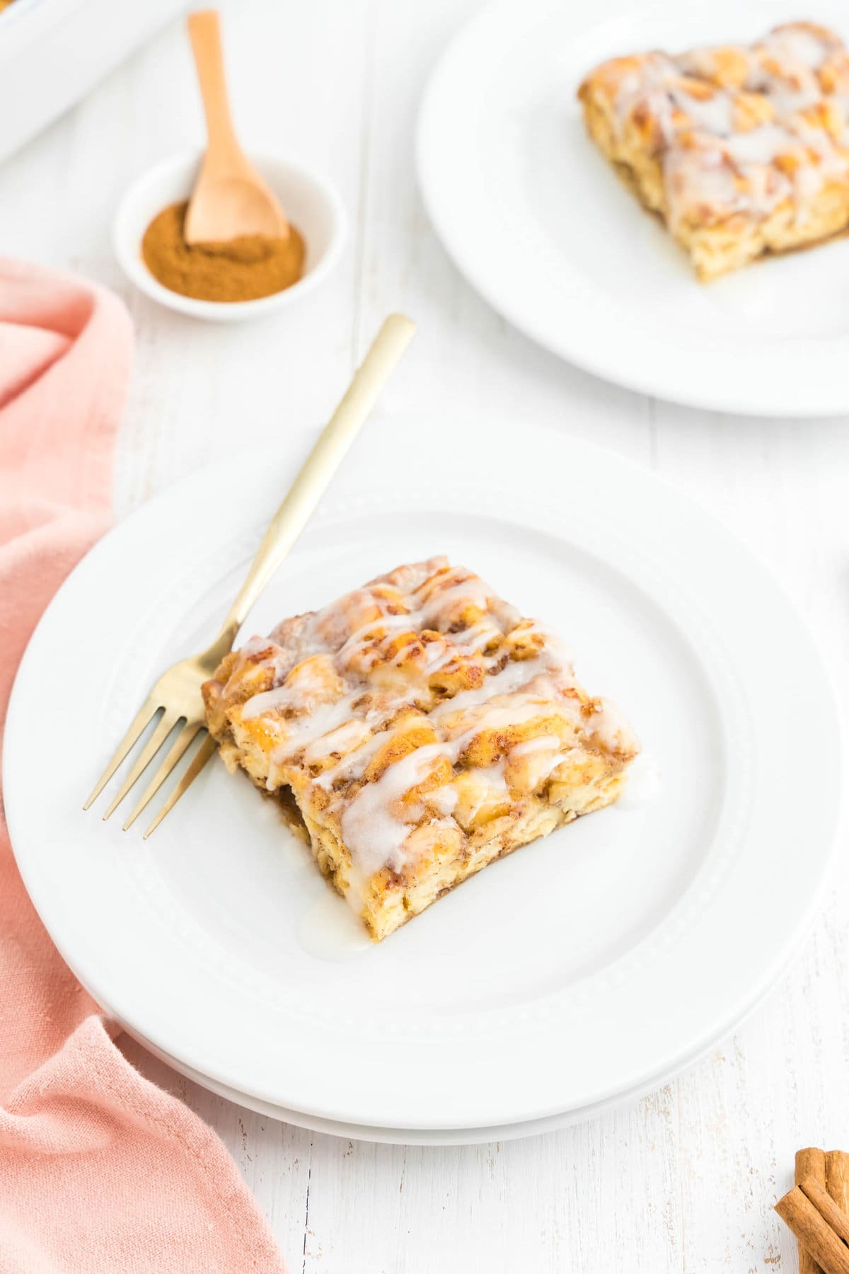 Cinnamon Roll Casserole square on plate with fork