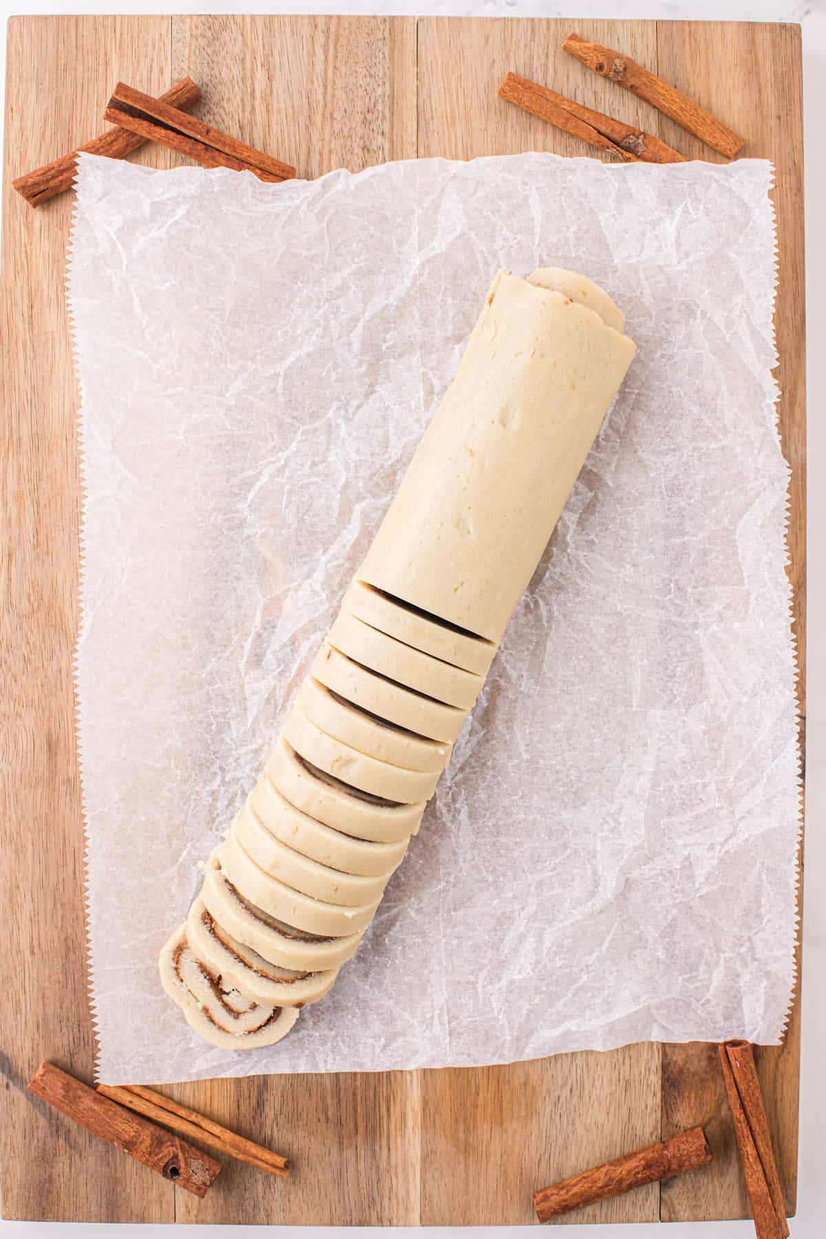 After Chilling, Slice Rolled Dough to Form Cinnamon Roll Cookies