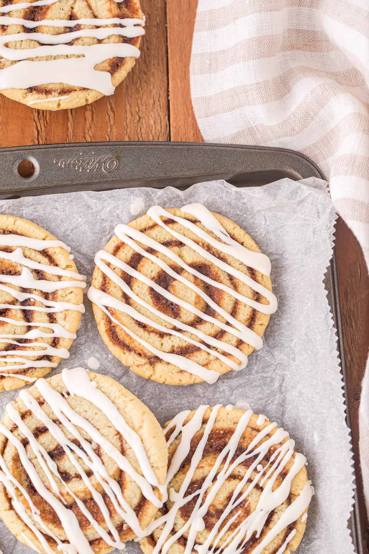 Cinnamon Roll Cookies on Parchment Lined Cookie Sheet 