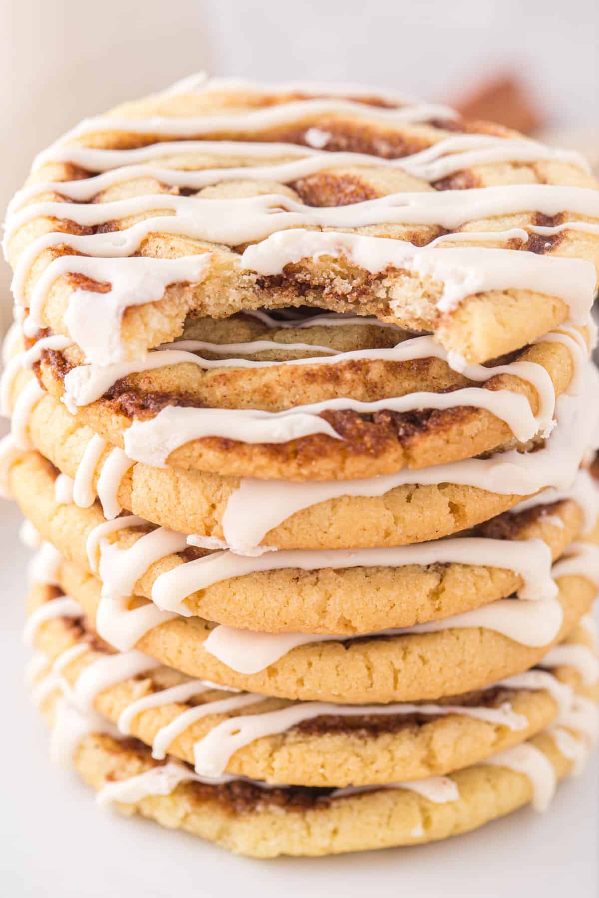 Cinnamon Roll Cookies stacked on white plate
