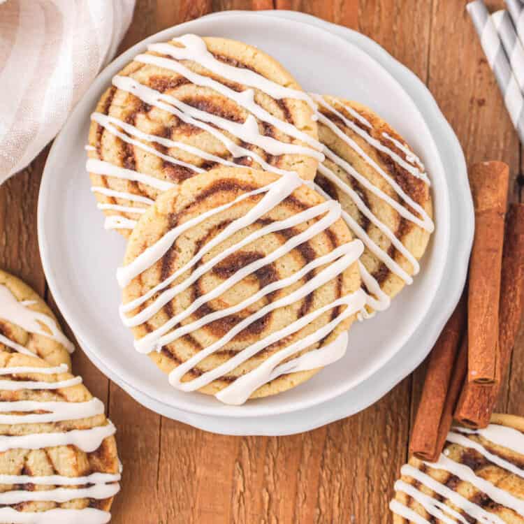 Plate of Cinnamon Roll Cookies Drizzled in Cream Cheese Frosting