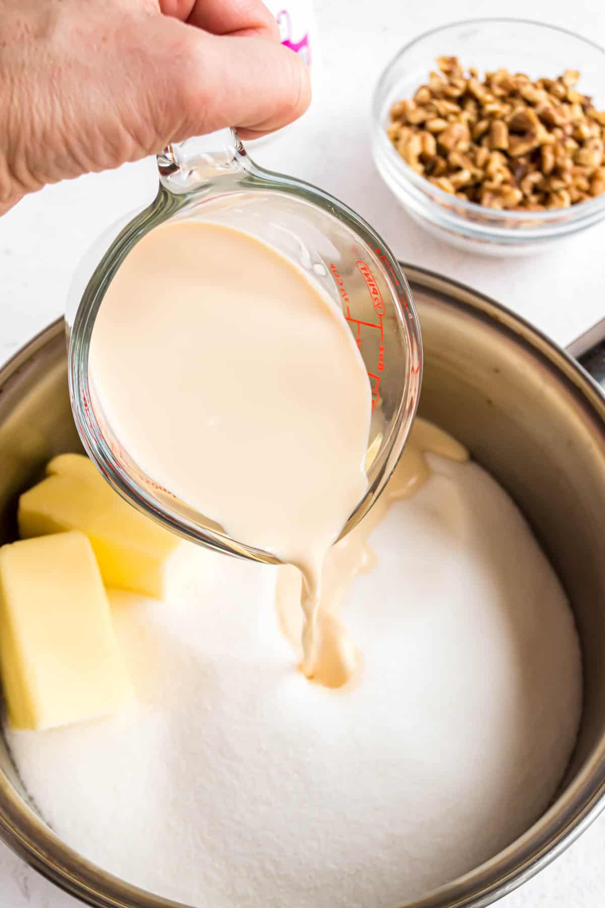 Combining Ingredients for Fantasy Fudge Recipe in Heavy Saucepan