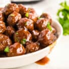 Grape Jelly Meatballs in serving bowl make a great appetizer