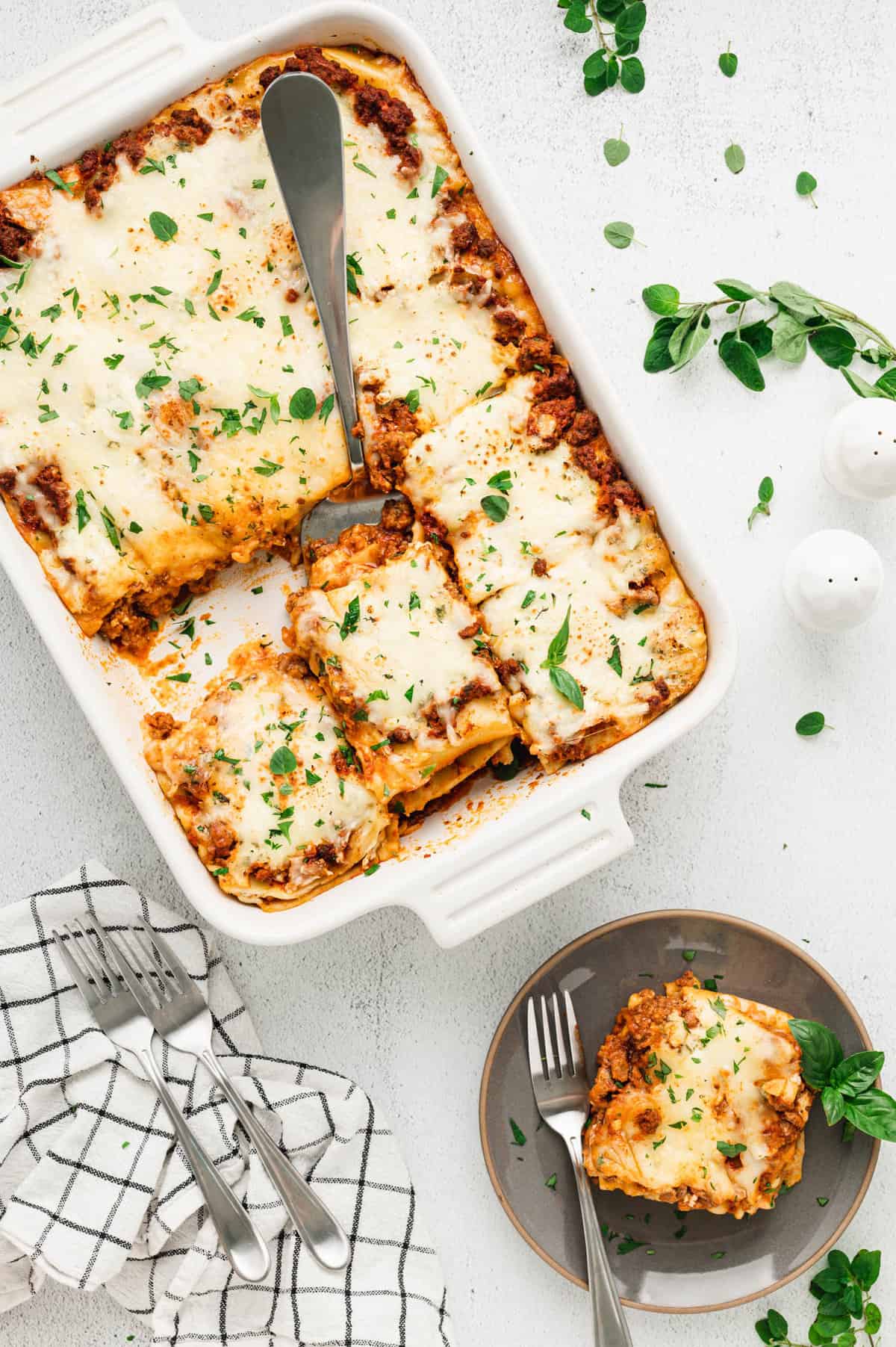 Easy Lasagna recipe topping with parsley cut into slice