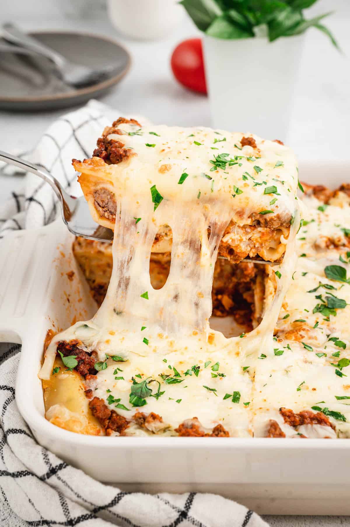 Easy Lasagna in baking dish cut and ready to enjoy