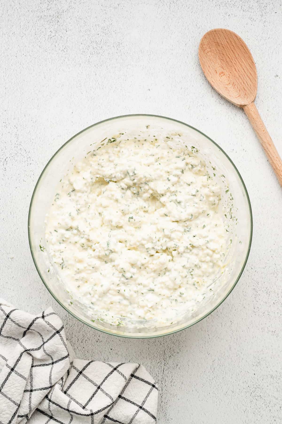 Mixed cheeses and seasonings in mixing for for Homemade Lasagna recipe