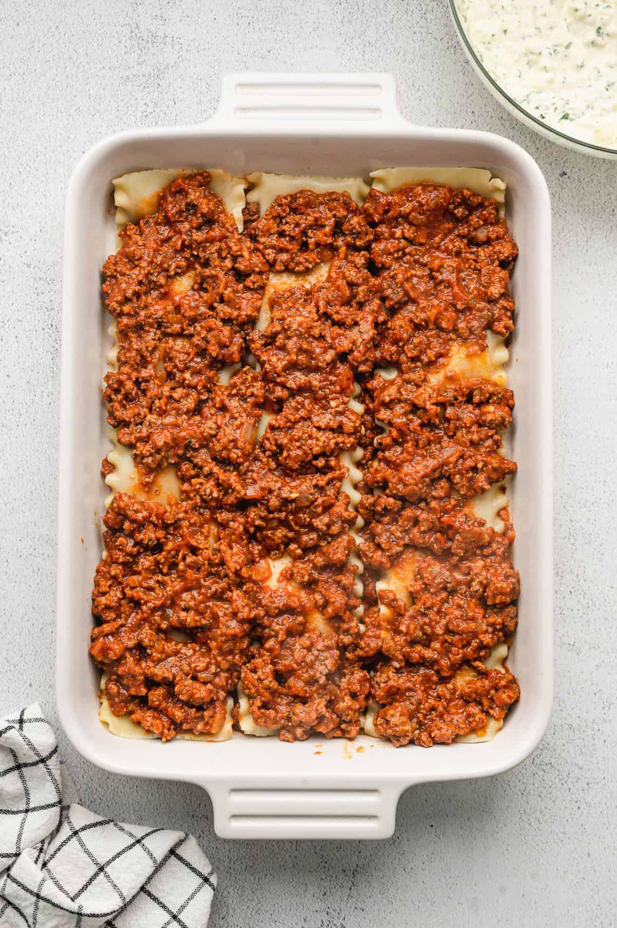 Continuing layering with more ground beef for Homemade Lasagna recipe