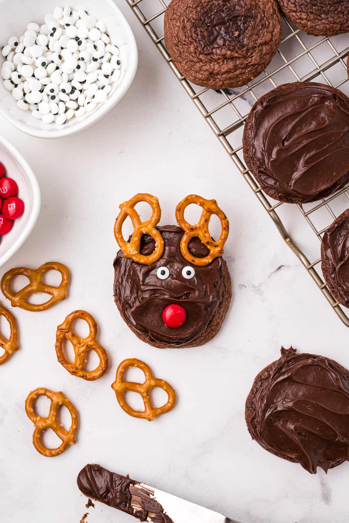 Add two Candy Eyeballs between the antlers and the nose.