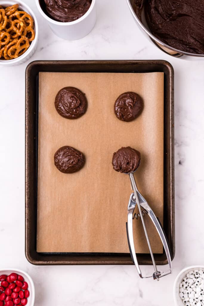 Using a Cookie scoop, scoop brownie dough onto prepared baking sheet.