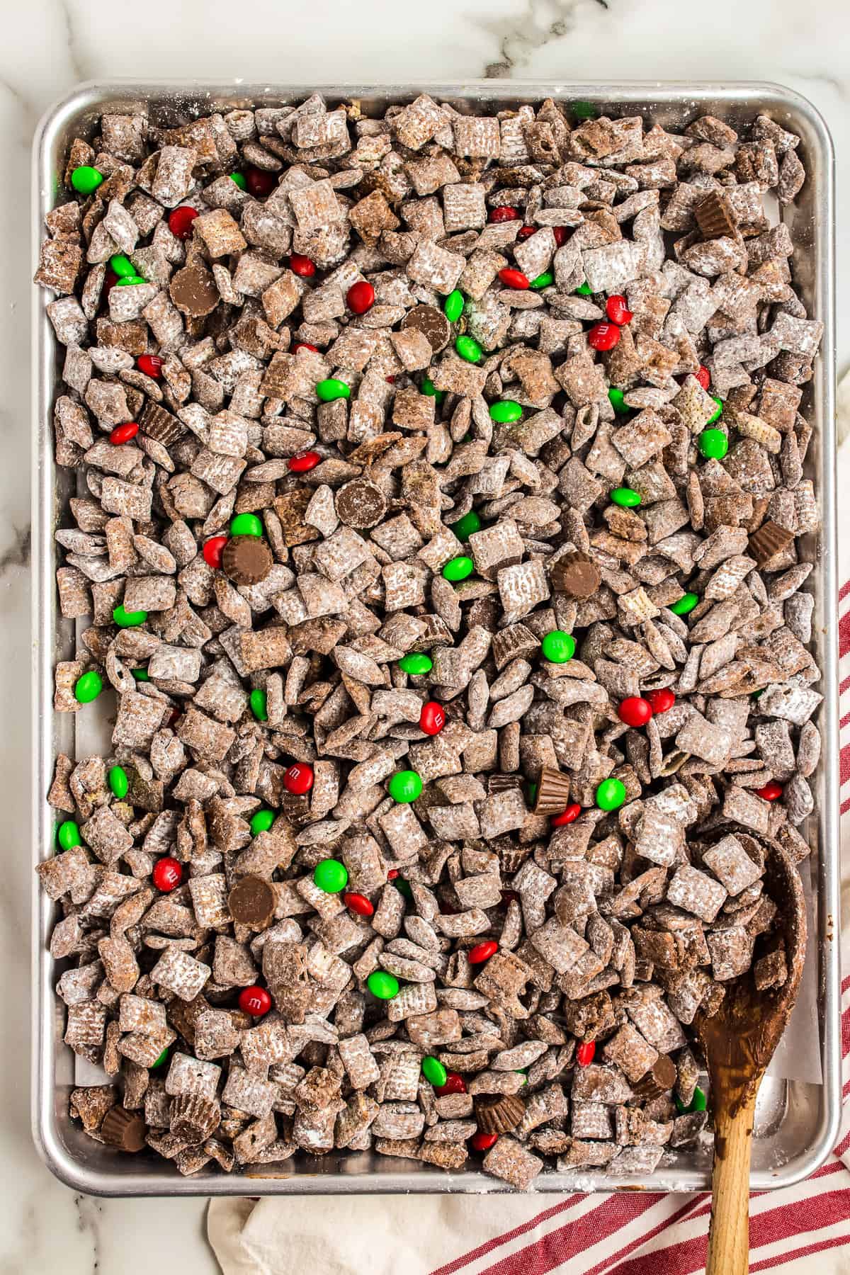 Spread out on a Baking sheet and add the M&Ms and mini PB Cups to the mixture.