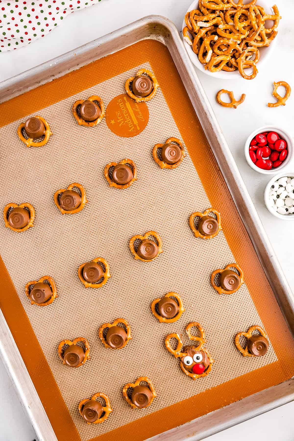 Remove from the oven and Place Googly Eyes, Nose and Antlers to each Rolo.