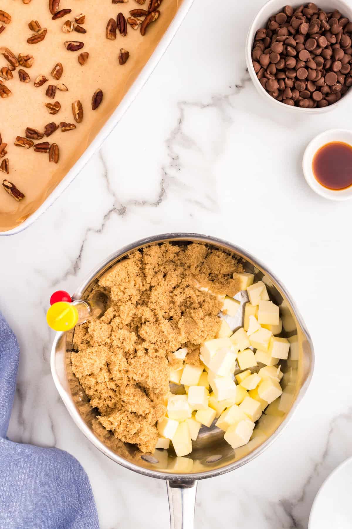 Placing Toffee ingredients in heavy bottomed saucepan with candy thermometer attached