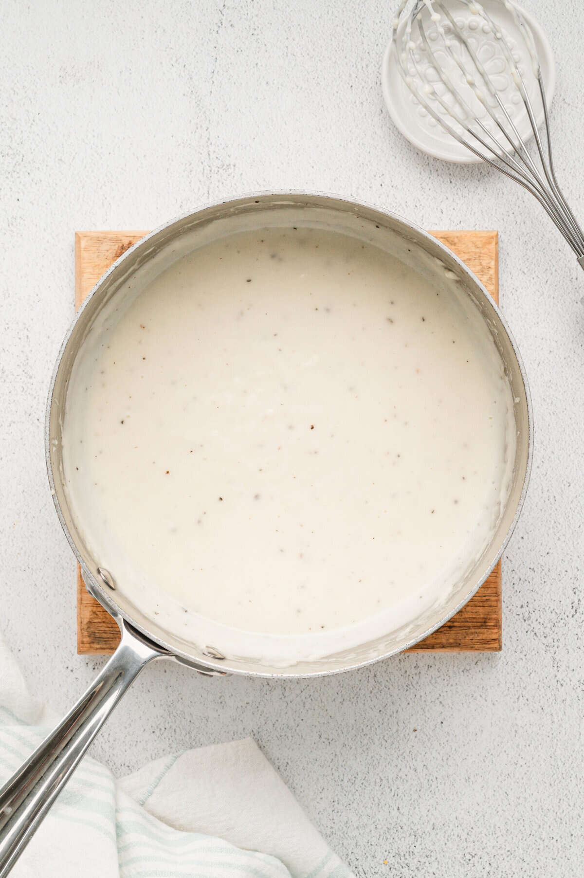 Gravy mixture in saucepan for Overnight Bicuits & Gravy Casserole recipe