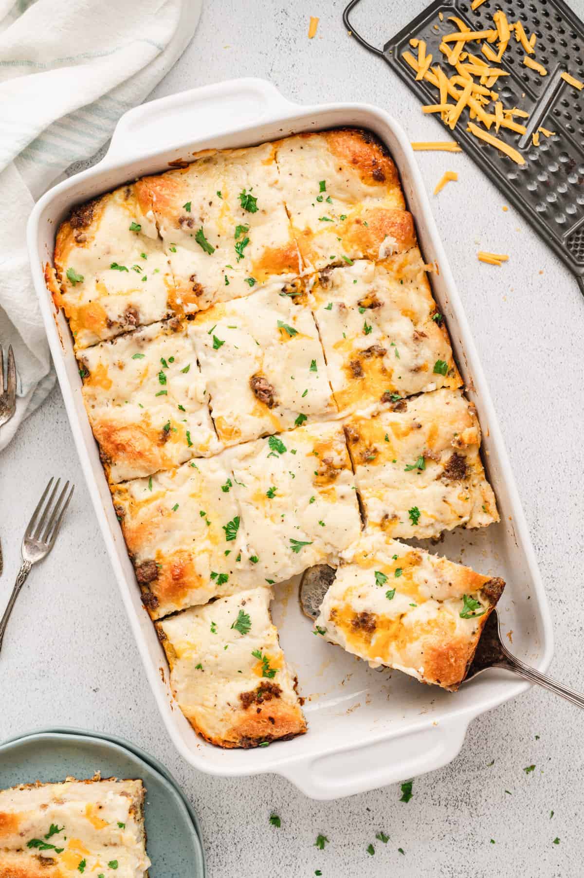 Overhead image of Biscuits & Gravy Casserole cut into pieces