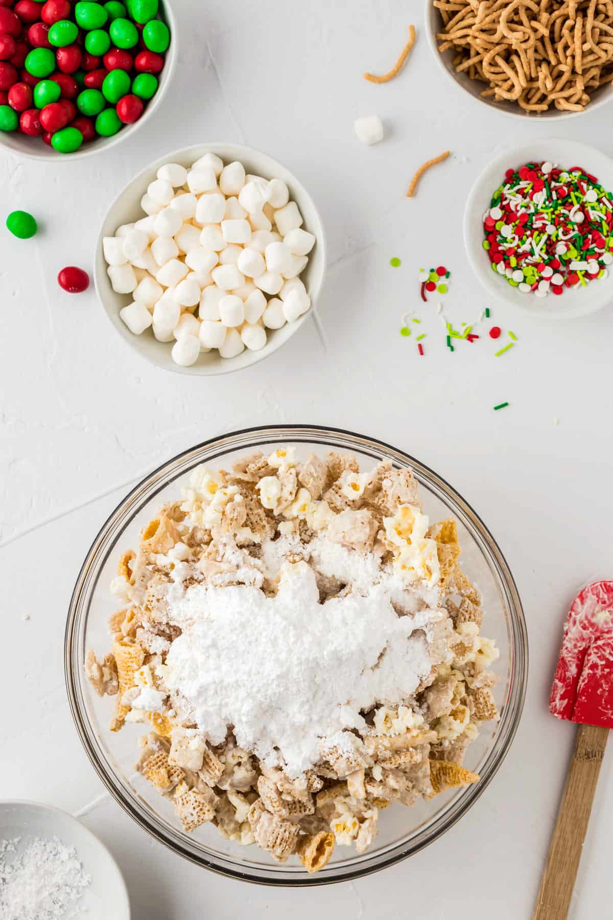 Once mixture is dry, break it apart and place it back into a bowl. Add Powdered sugar and toss around until fully coated.