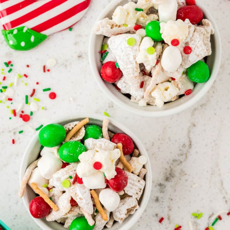 Overhead Image of two white bowls full of Snack Mix