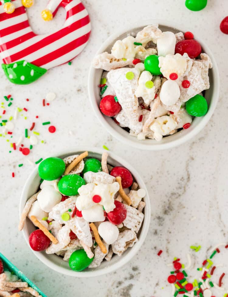 Overhead Image of two white bowls full of Snack Mix