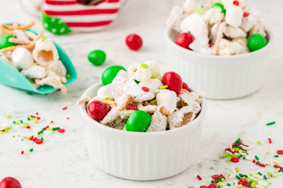 Two white bowls full of Snack Mix.