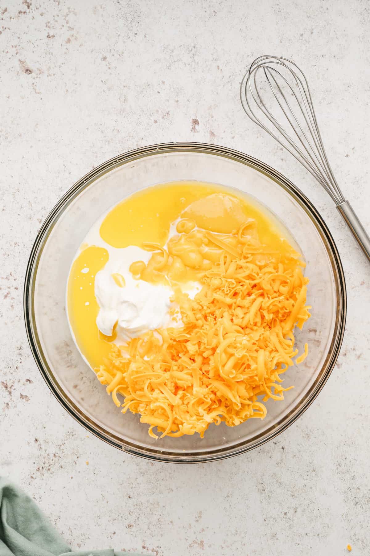 Ingredients for Funeral Potatoes in glass mixing bowl